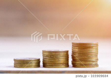 Coin stacks on wood table background. Coin stacks on wood table background. 103909684