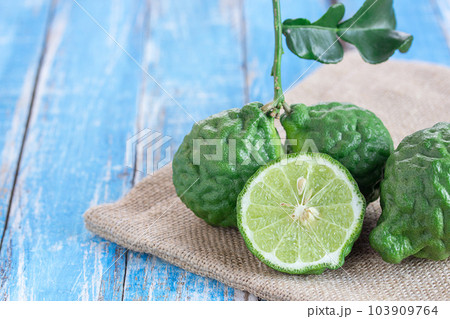 Close up bergamot on wooden table background. Close up bergamot on wooden table background. 103909764