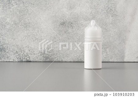 Refill liquid for electronic cigarettes on gray background 103910203