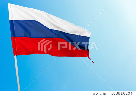 Russian flag against blue sky 103910204