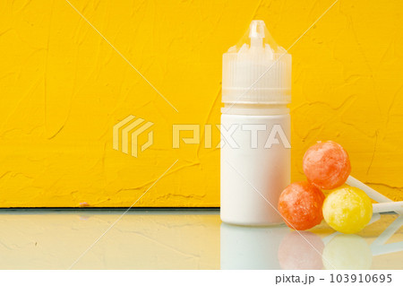 Bottle with aromatic vaping liquid for e-cigarette, candy flavour Bottle with aromatic vaping liquid for e-cigarette, candy flavour 103910695