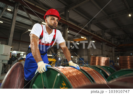 Portrait of african american male handyman working in an industrial factory 103910747