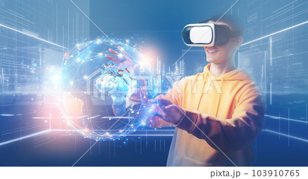 Young man enjoying Metaverse virtual reality with VR glasses 103910765