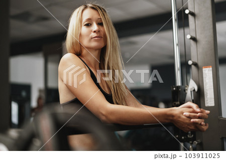 Fitness woman in sport outfit exercising in gym Fitness woman in sport outfit exercising in gym 103911025