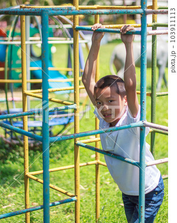 Cute asian child having fun at playground. Cute asian child having fun at playground. 103911113