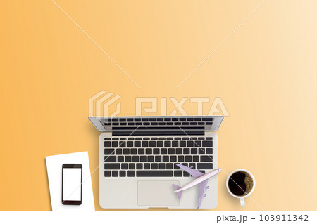 Office desk or workspace with laptop computer, coffee cup and smartphone with copy space  103911342