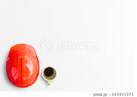 Red safety engineer helmet and cup of coffee isolated on white background. 103911371