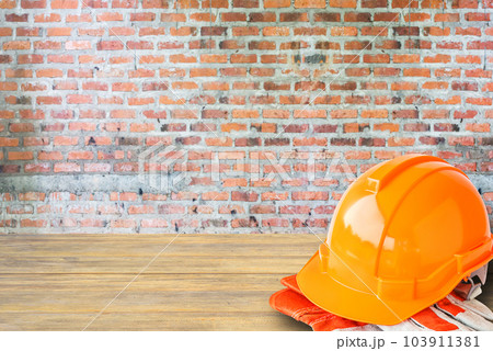 orange hard safety helmet construction hat for safety project of workman as engineer or worker 103911381