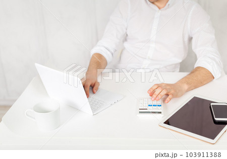 man working on tablet man working on tablet 103911388