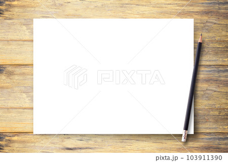 White blank paper or notepad with pencil on brown wood table background 103911390