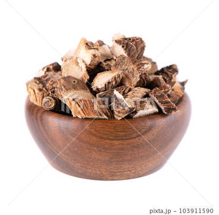 Calamus root in wooden bowl, isolated on white background. Sweet flag, sway or muskrat root. Dry root of Acorus calamus. Calamus root in wooden bowl, isolated on white background. Sweet flag, sway or muskrat root. Dry root of Acorus calamus. 103911590