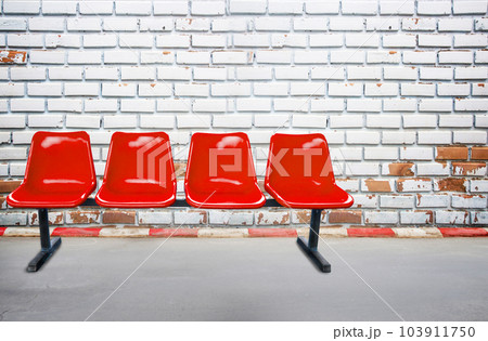 Background view from footpath with red chair old brick wall background and texture. 103911750