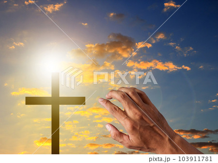 Silhouette cross in blue sky background 103911781