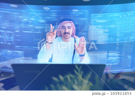 Muslim businessman working with floating data visualization screen Muslim businessman working with floating data visualization screen 103911855
