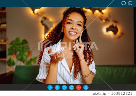 Headshot portrait screen view of young African American woman sit at home talk on video. 103912823