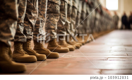 Section of soldiers legs in military uniform and boots standing in line at camp, american army 103912831