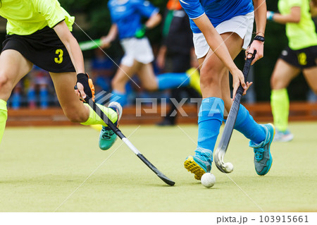 Close up image of attack in field hockey game Close up image of attack in field hockey game 103915661