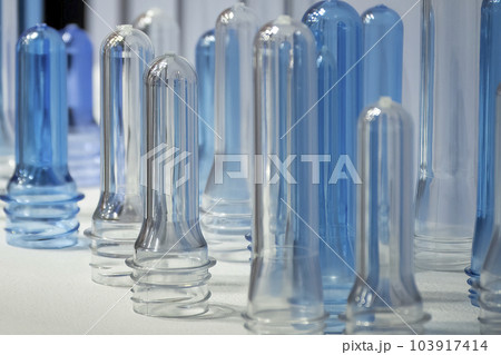 Close up scene of group of preform shape of PET bottle products. 103917414