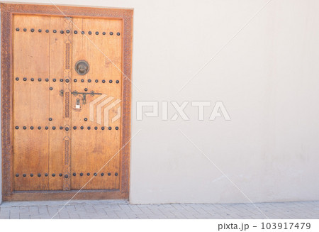 Old gate in the old district of Sharjah city. Place for text Old gate in the old district of Sharjah city. Place for text 103917479