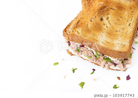 Tuna sandwich with mayo and vegetables isolated on white background Tuna sandwich with mayo and vegetables isolated on white background 103917743