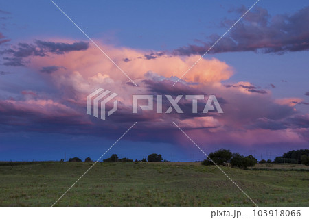 Stormy sky at sunset in the pampas field, La Pampa, Argentina. Stormy sky at sunset in the pampas field, La Pampa, Argentina. 103918066