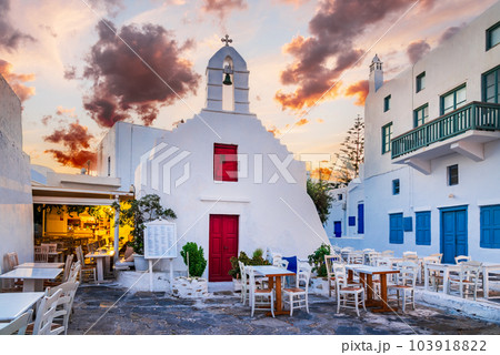 Mykonos, Greece - Cobblestone alley whitewashed village Cyclades Greek Islands 103918822