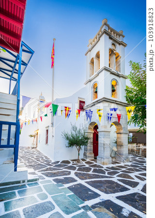 Mykonos, Greece - Cobblestone alley whitewashed village Cyclades Islands 103918823