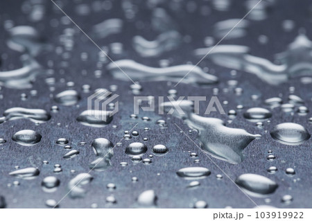 Drops of water on a gray background closeup Drops of water on a gray background closeup 103919922