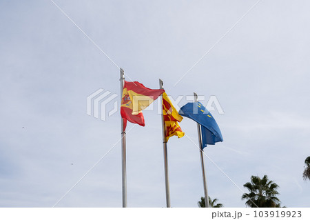 Flags spain european union catalonia on blue sky background Flags spain european union catalonia on blue sky background 103919923