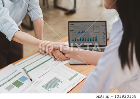 Business people handshake. Successful business team handshaking after good deal. Finishing up meeting concept Business people handshake. Successful business team handshaking after good deal. Finishing up meeting concept 103920359