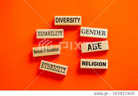 Diversity symbol. Diversity ethnicity gender age sexual orientation religion disability words written on wooden block. Beautiful orange background. Equality and diversity concept. Copy space. 103921920