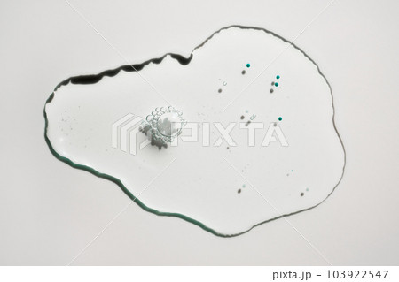 Sample drop of cosmetic product with blue particles Sample drop of cosmetic product with blue particles 103922547