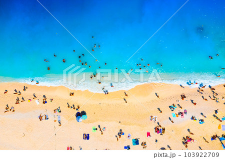 A drone view of the beach and the sea. People on vacation. Vacation and holidays.  A drone view of the beach and the sea. People on vacation. Vacation and holidays.  103922709