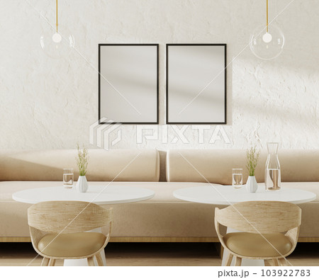 Two empty poster frames above light beige sofa in cafe with round coffee tables and chairs, 3d rendering 103922783