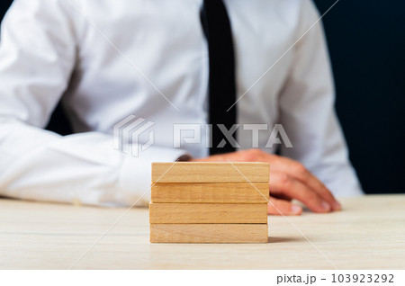 Stack of four blank wooden pegs Stack of four blank wooden pegs 103923292