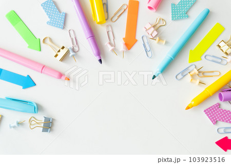 Stationery, school supplies on a white table in bright pastel colors. 103923516