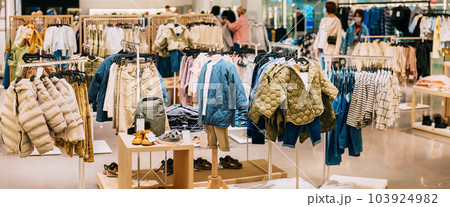 Children Male Man Casual Clothes And Children Clothes On Shelves And Hanger In Store Of Shopping Center. Stack Of jackets In Store Of Shopping Center. shelf display in shop mall store. Store Of Children Male Man Casual Clothes And Children Clothes On Shelves And Hanger In Store Of Shopping Center. Stack Of jackets In Store Of Shopping Center. shelf display in shop mall store. Store Of 103924982