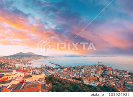 Naples, Italy. Skyline Cityscape City In Evening Sunset. Tyrrhenian Sea And Landscape With Volcano Vesuvius Naples, Italy. Skyline Cityscape City In Evening Sunset. Tyrrhenian Sea And Landscape With Volcano Vesuvius 103924985