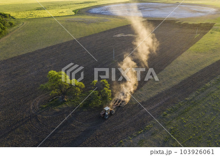 Tractor plowing the field, Pampas countryside, La Pampa, Argentina. Tractor plowing the field, Pampas countryside, La Pampa, Argentina. 103926061