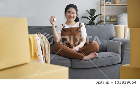 Woman owner buy purchase home, relocate to dwelling, rental, rent, ownership concept Woman owner buy purchase home, relocate to dwelling, rental, rent, ownership concept 103929064