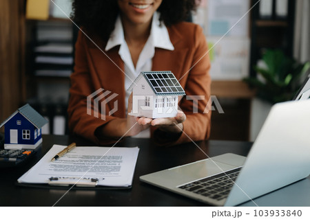 Considering buying a home, investing in real estate. Broker signs a sales agreement. agent, lease agreement, successful deal . 103933840