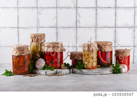 Pickled vegetables in glass jars. Pickled vegetables in glass jars. 103938507
