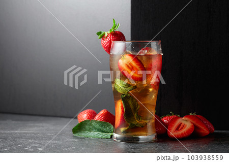 Cocktail with ice, mint, and strawberries. Cocktail with ice, mint, and strawberries. 103938559