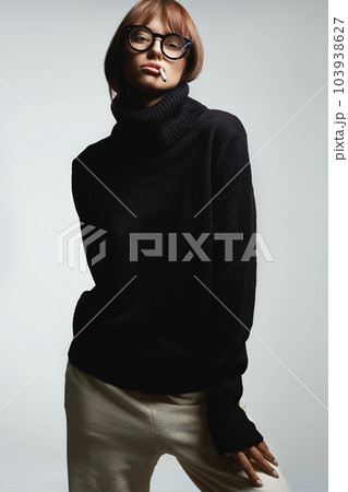 beautiful smoking woman in glasses. pretty girl with cigarette 103938627