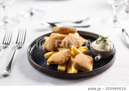 Kids menu ina fancy restaurant with chicken nuggets and potato wedges with mayonnaise Kids menu ina fancy restaurant with chicken nuggets and potato wedges with mayonnaise 103940019