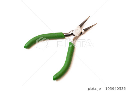 Green pliers isolated on white background closeup Green pliers isolated on white background closeup 103940526