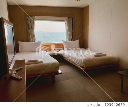 Bedroom with interior of double passenger cabin ferry ship with ocean view. Bedroom with interior of double passenger cabin ferry ship with ocean view. 103940679