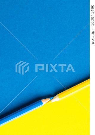 Close up of yellow and blue pencils with copy space on yellow and blue background Close up of yellow and blue pencils with copy space on yellow and blue background 103941490