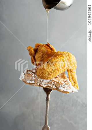 Fried chicken wing with a waffle 103942661