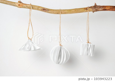 Christmas Paper Star and Ball Decoration. Handmade Christmas Nordic Decor on a Light Background against the Wall. Boho, Scandinavian Style Design. DIY. Minimal Ornament. Structural Origami. Zero Waste 103943223